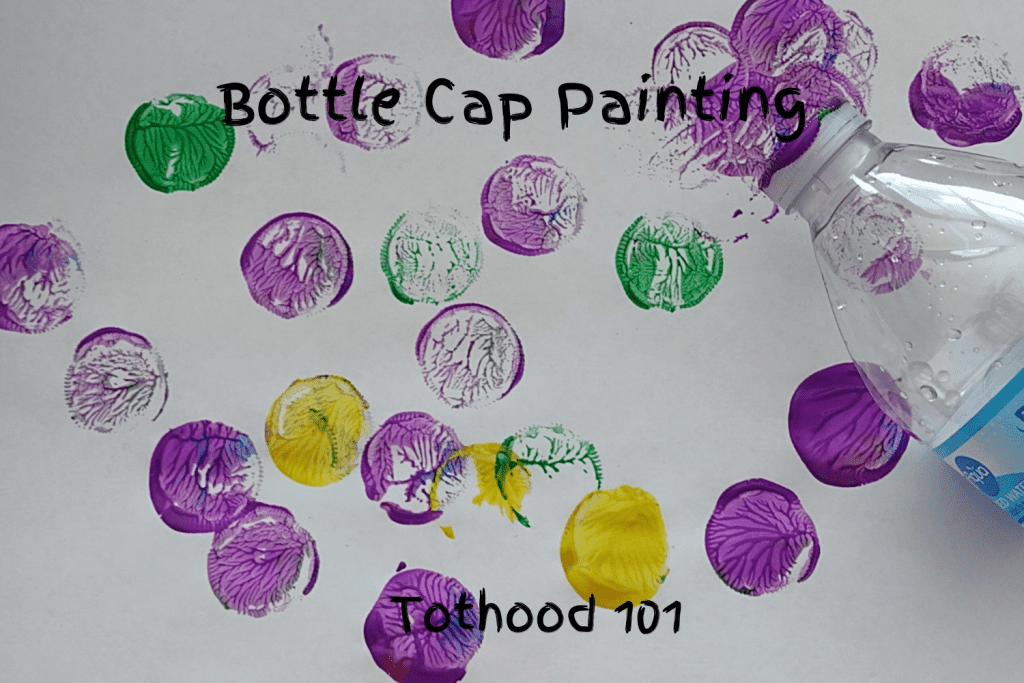 Bottle cap painting activity done with purple, green, and yellow paint.
