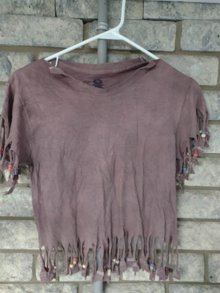 brown dyed shirt with fringe cut to be an Indian outfit.