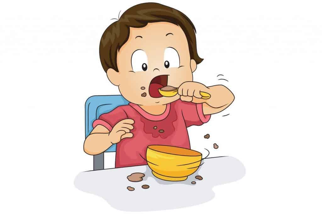 Boy eating porridge
