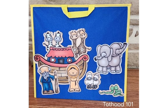 Flannel graph board with Noah his wife and ark, and animals